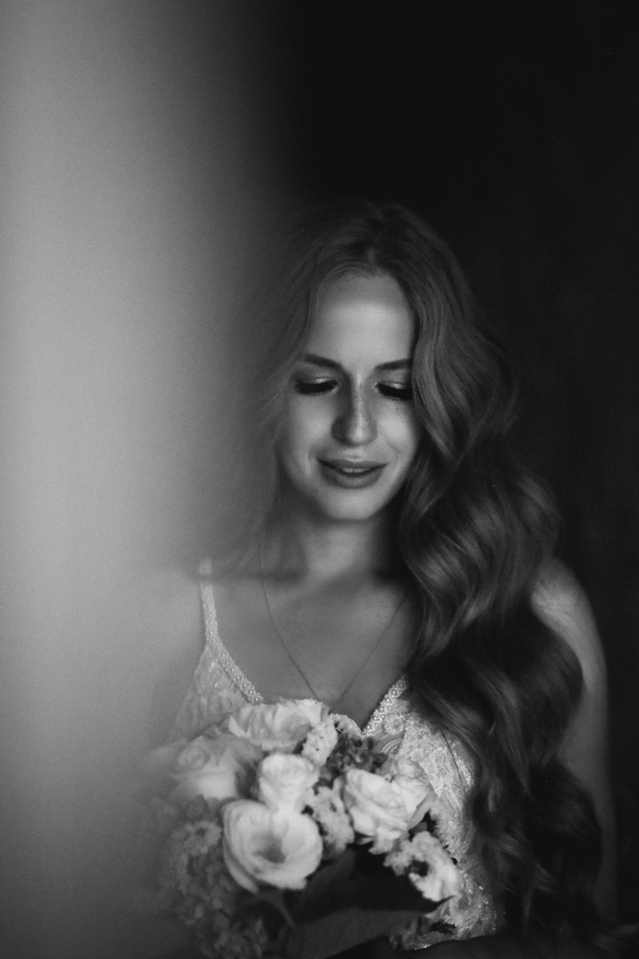 Black and white photo of a bride in Georgia with wine