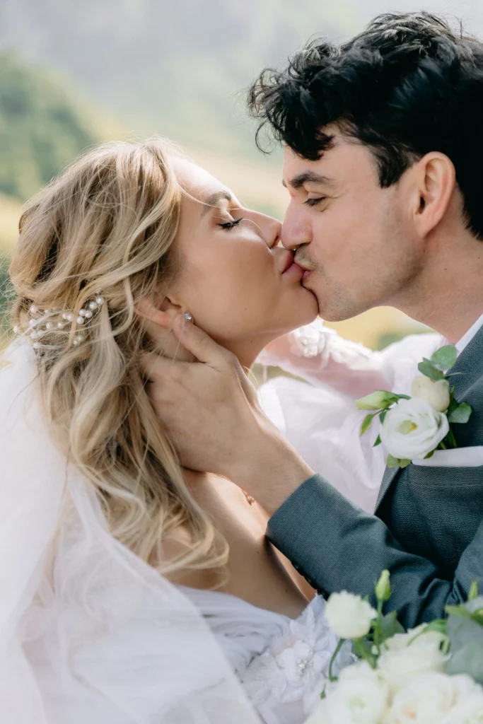 Kissing couple in the mountains of Georgia