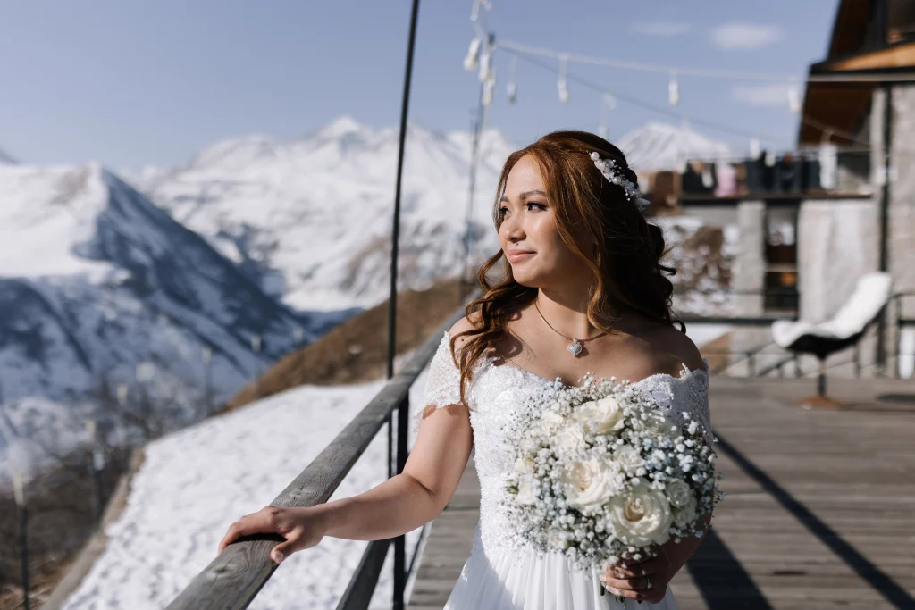 Bride in the snowy mountains of Georgia